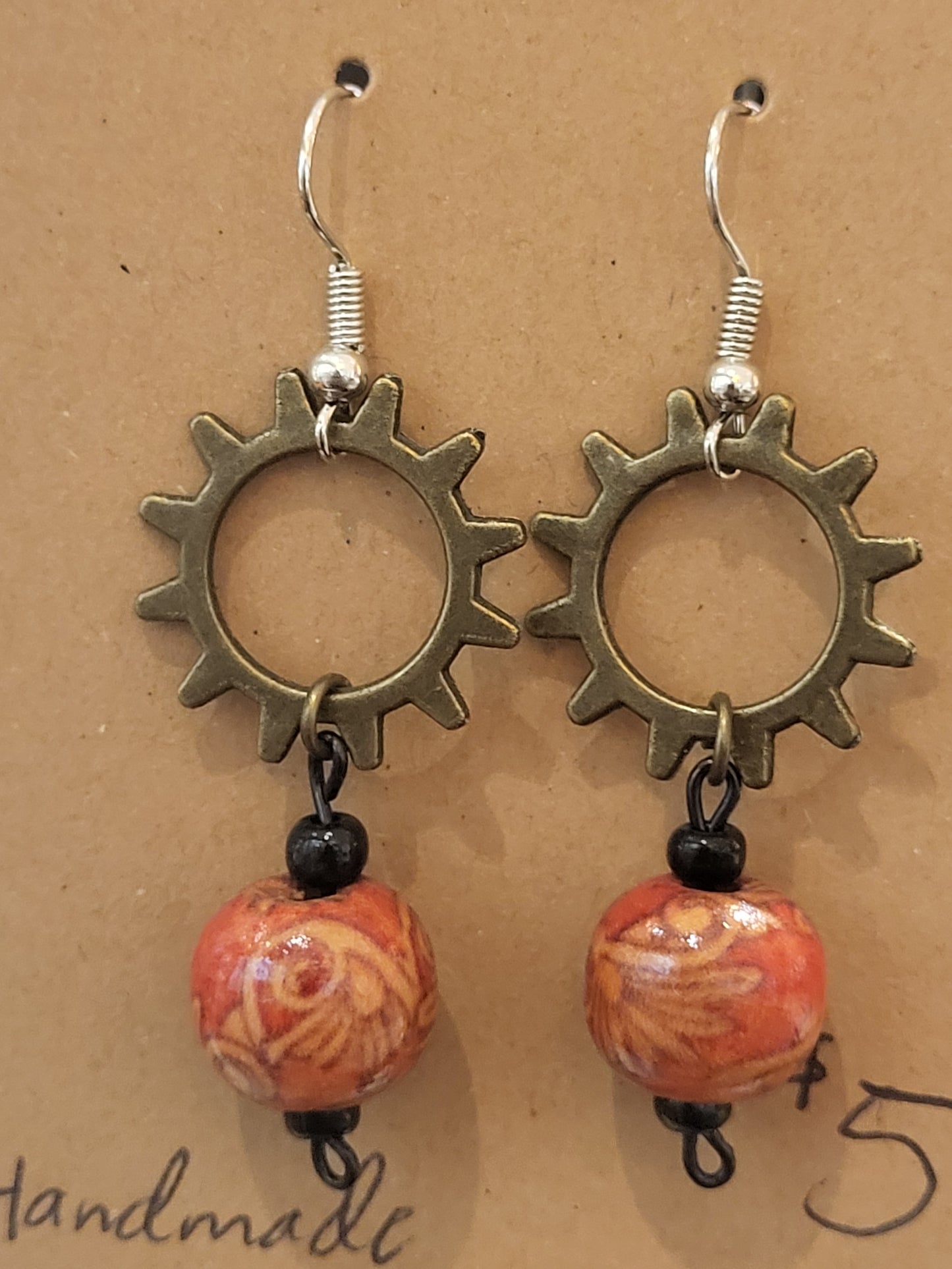 Handmade ornate red bead and sun gear earrings top
