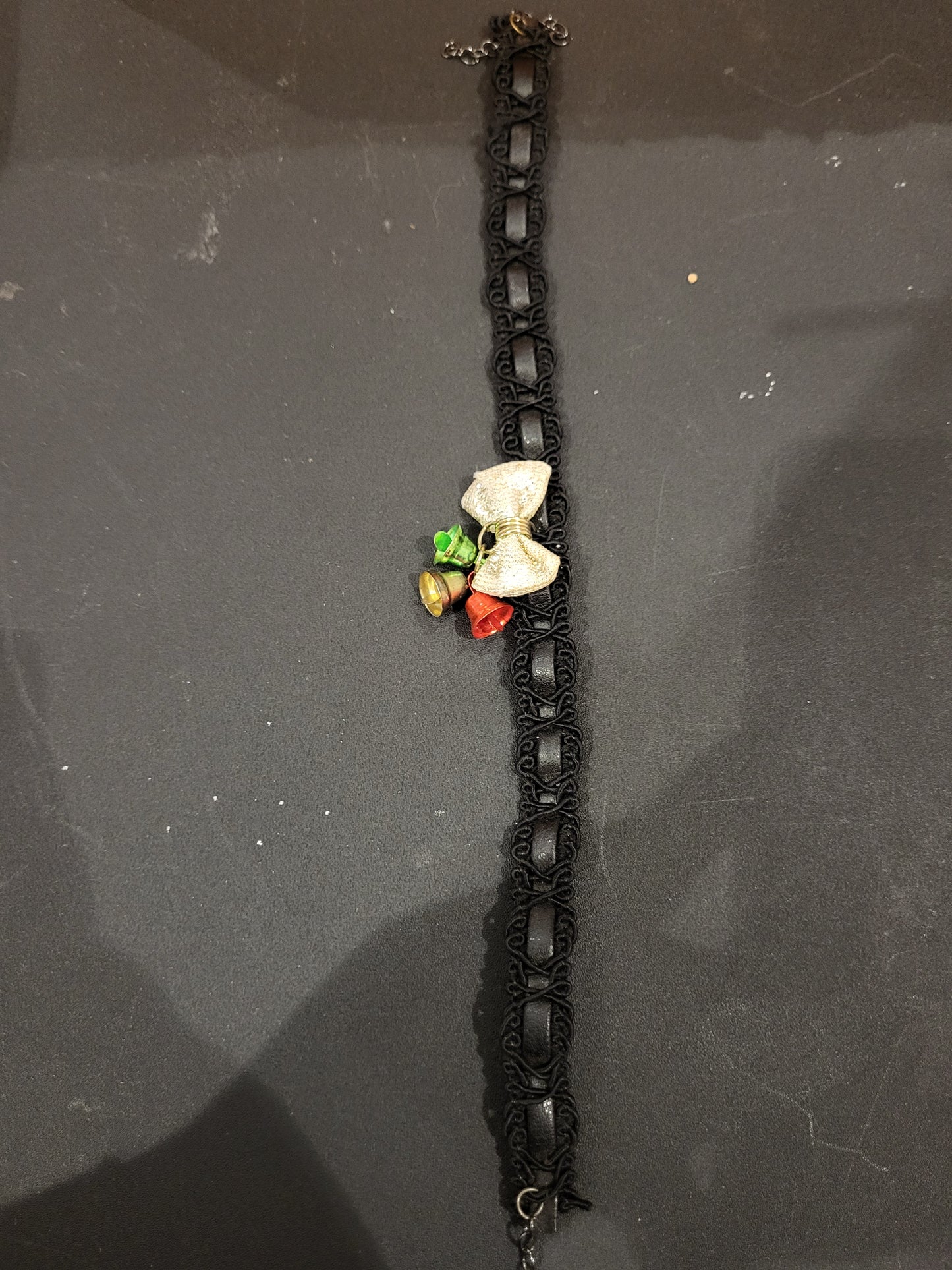 Handmade black and gold choker with jingle bells