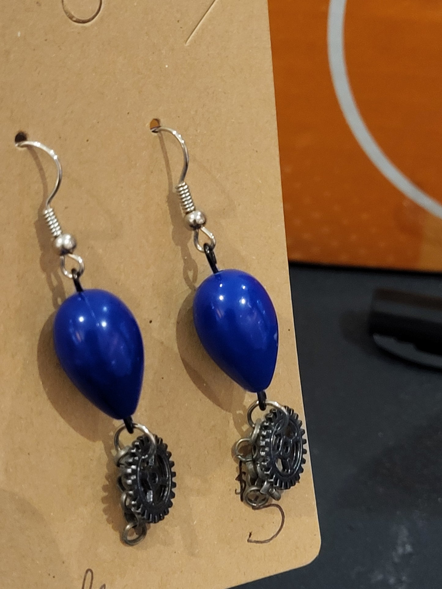 Handmade blue teardrop bead earrings with gear