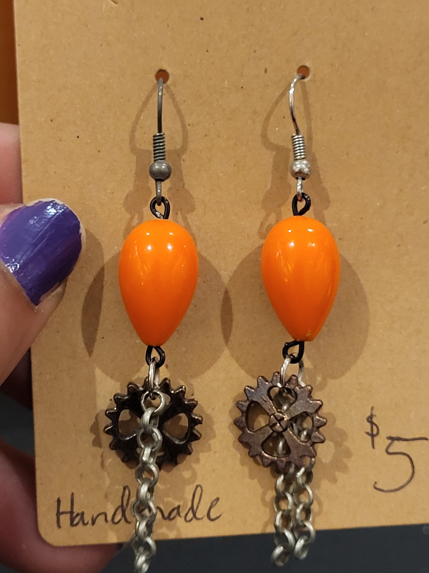 Handmade orange teardrop bead earrings with gear