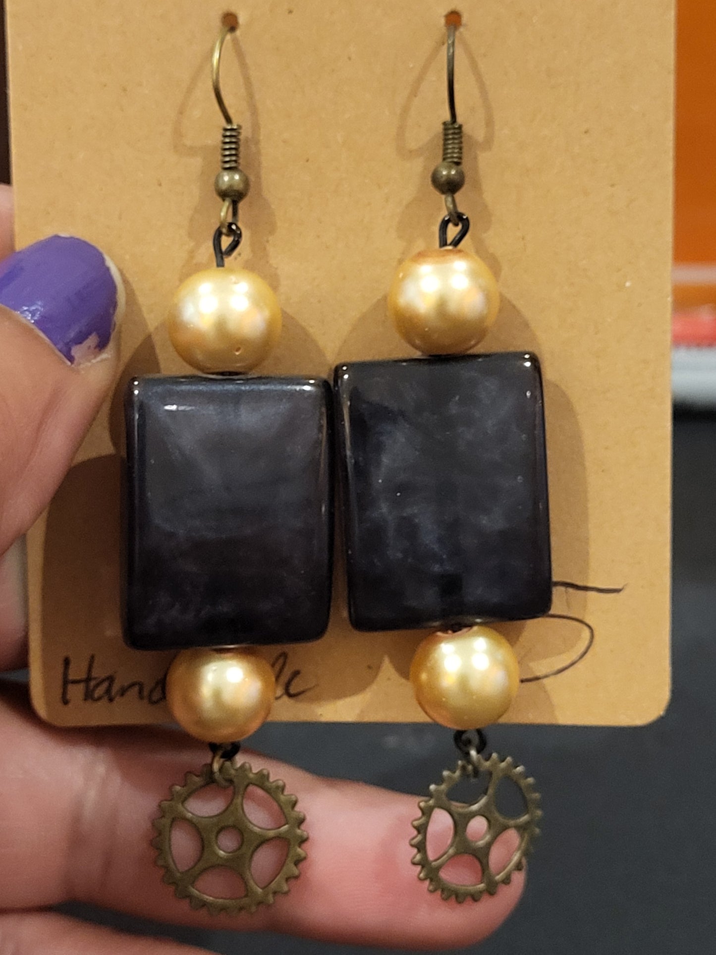 Handmade rectangle black and gold beaded earrings with gear