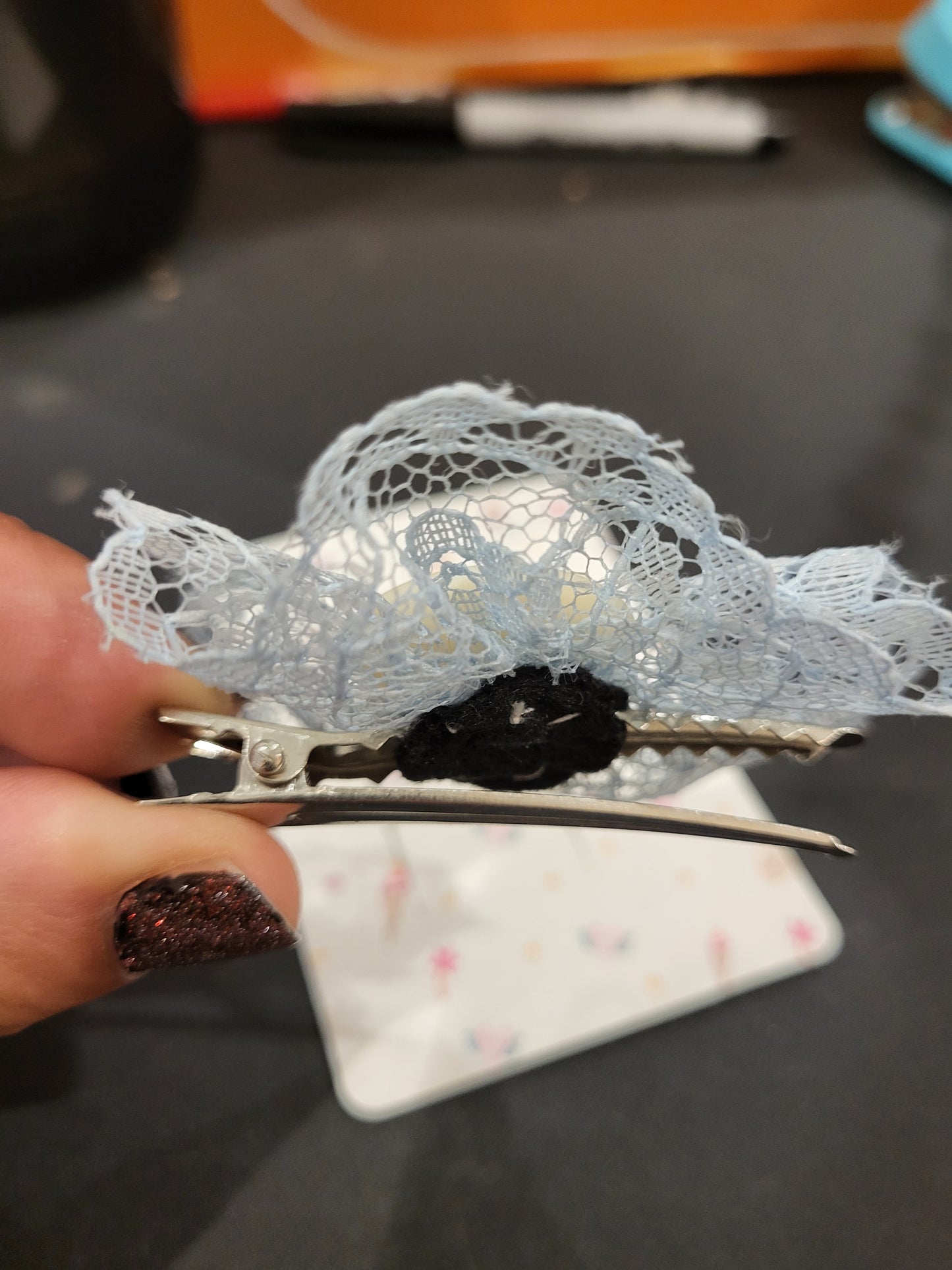 Handmade blue lace hair clip with off white button