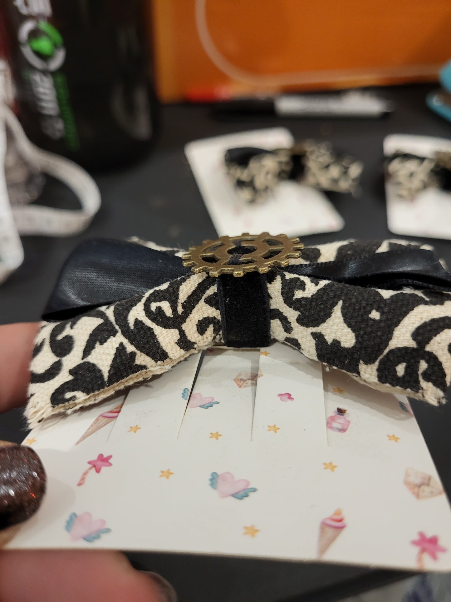 Handmade white and black hair bow with gear