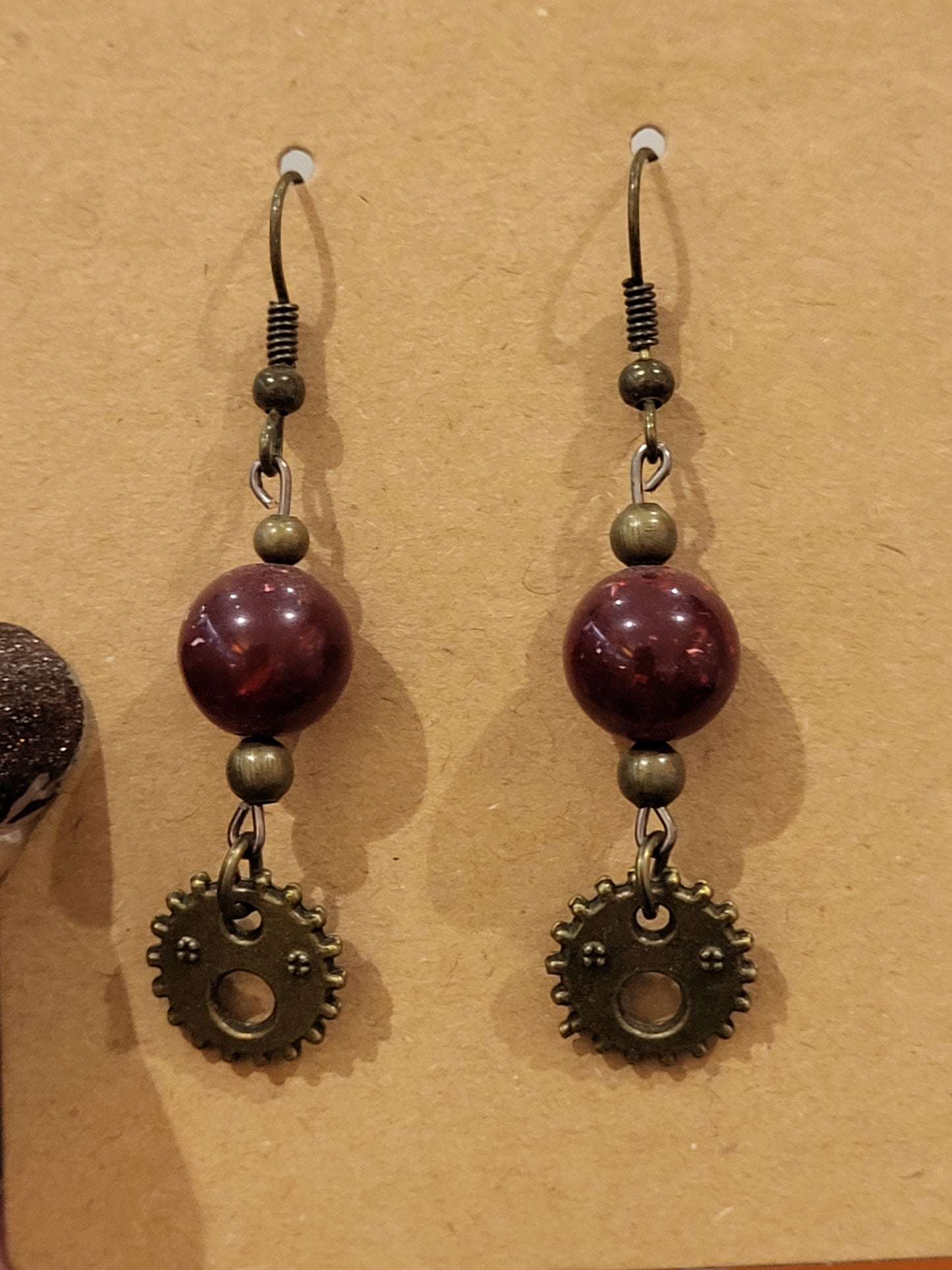 Handmade red bead and small face gear earrings