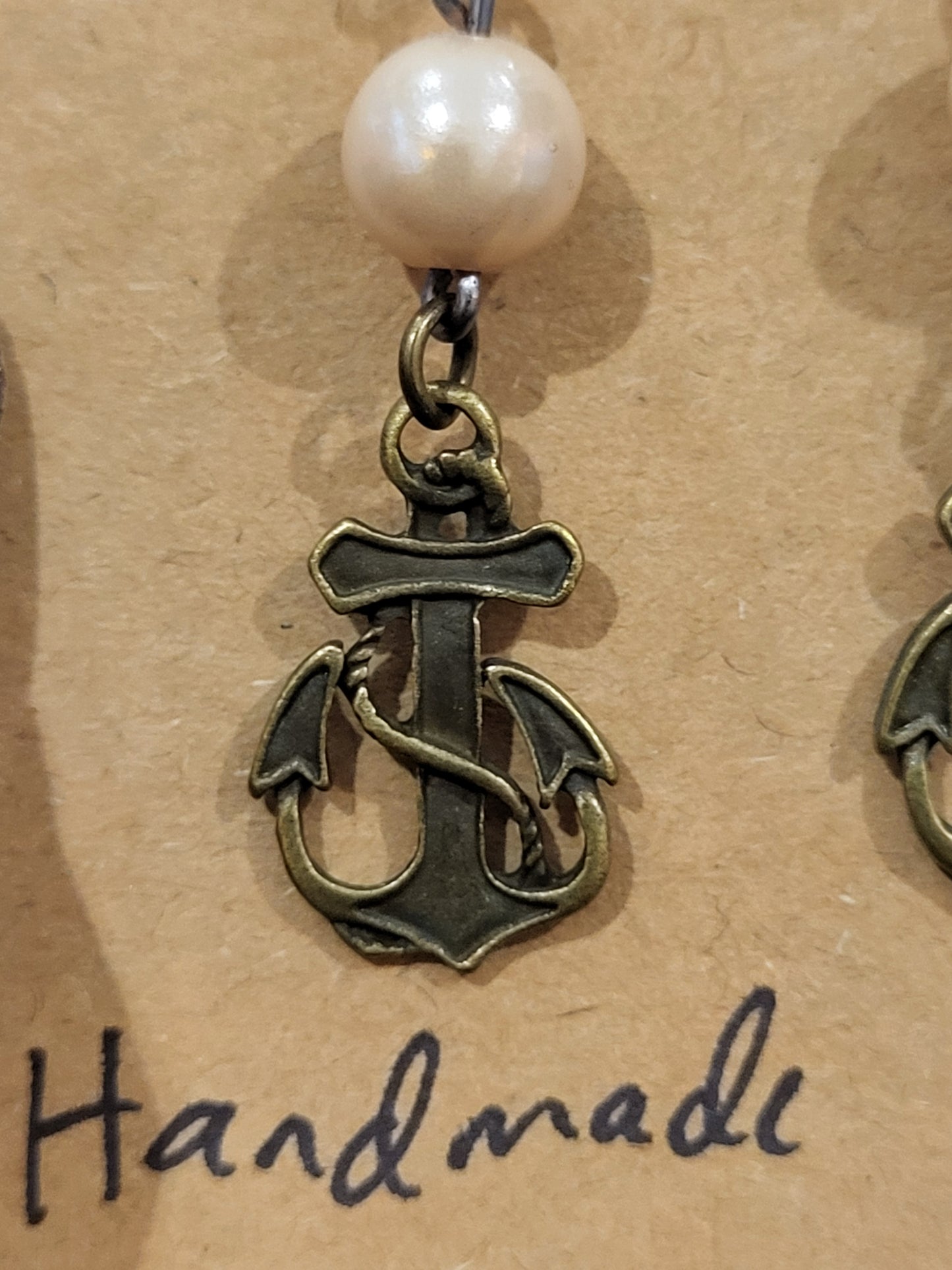 Handmade simple beige bead earrings with anchor charm