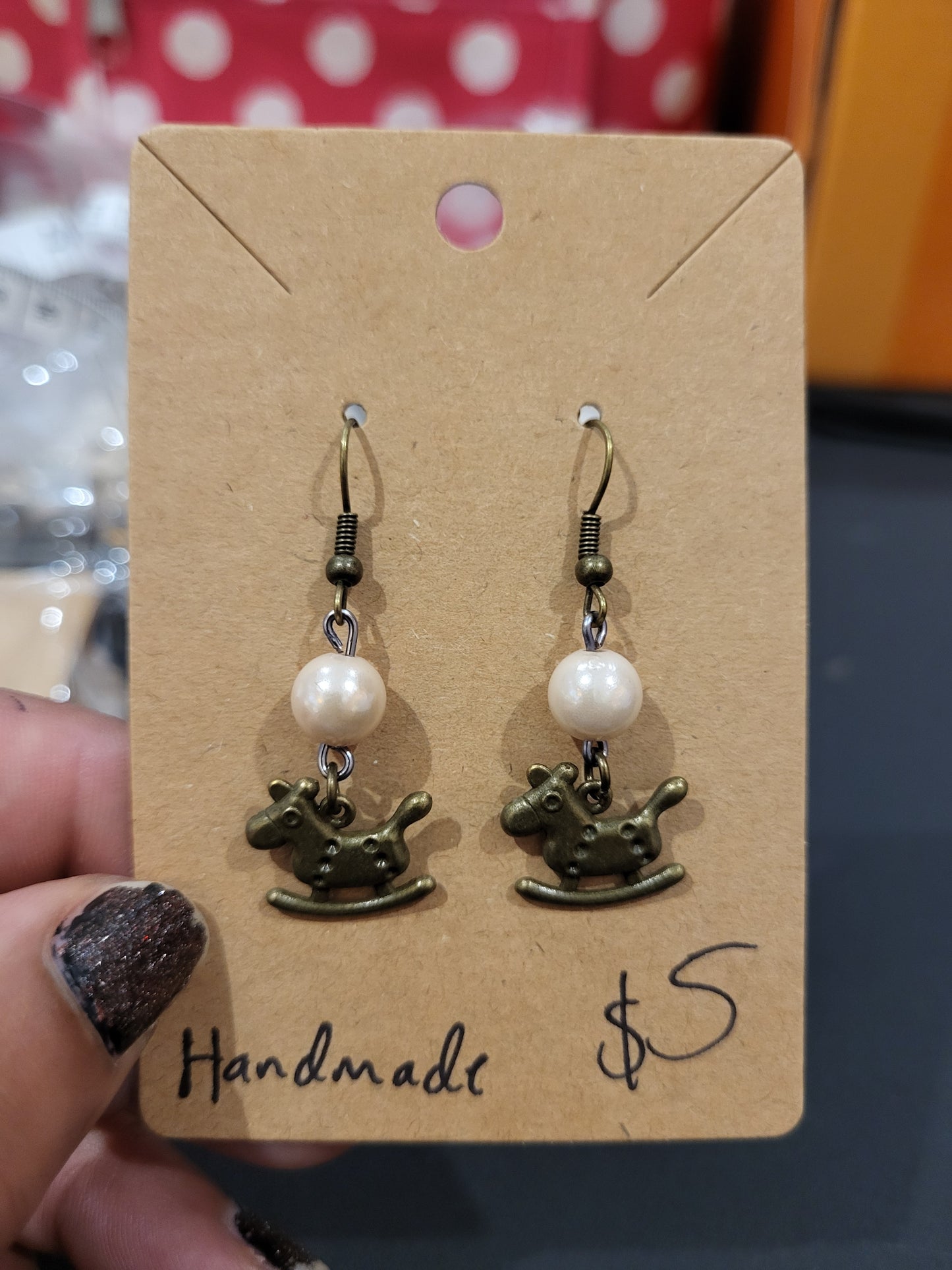Handmade simple beige bead earrings with rocking horse charm