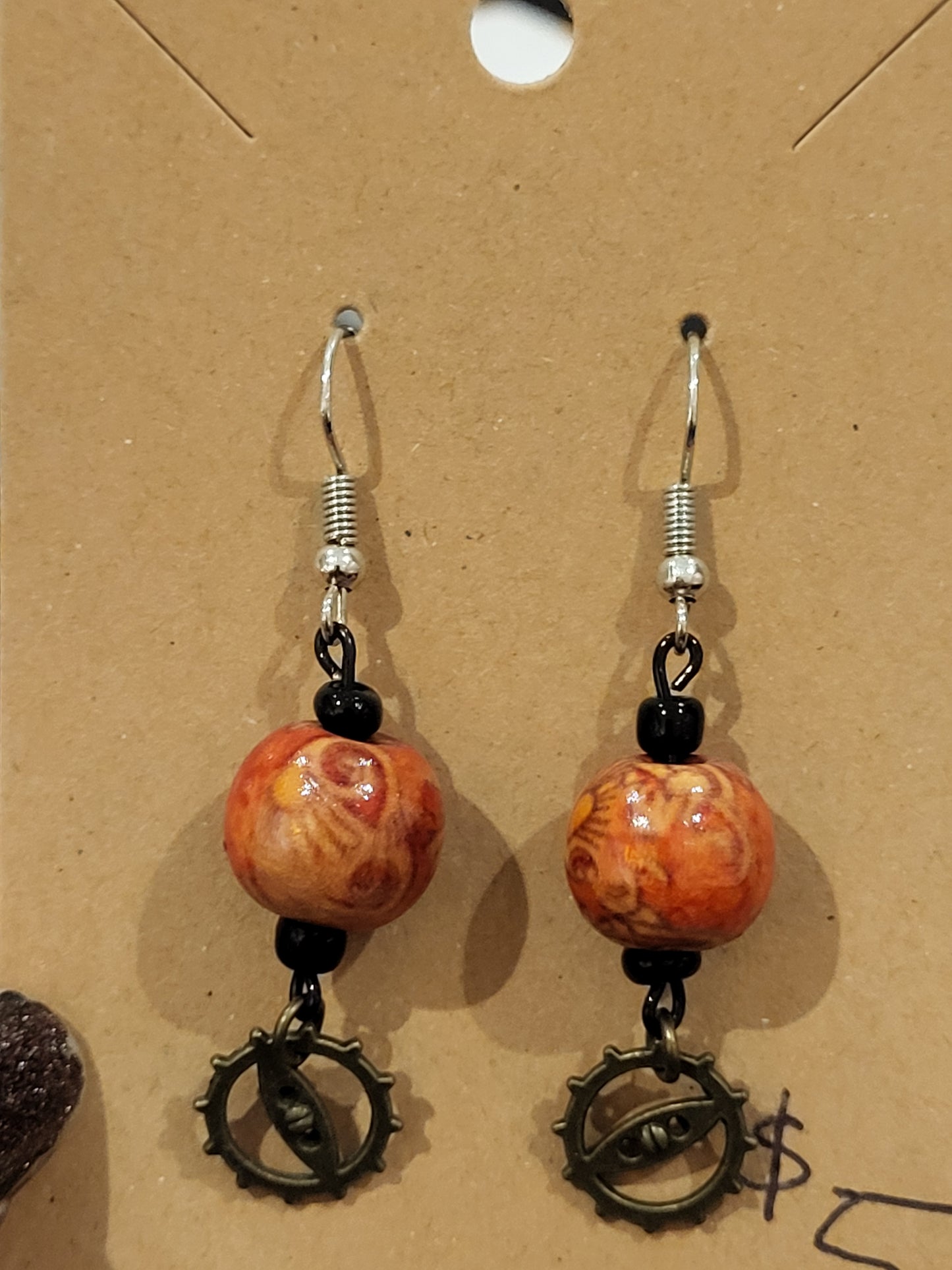 Handmade ornate red bead and mini gear earrings bottom