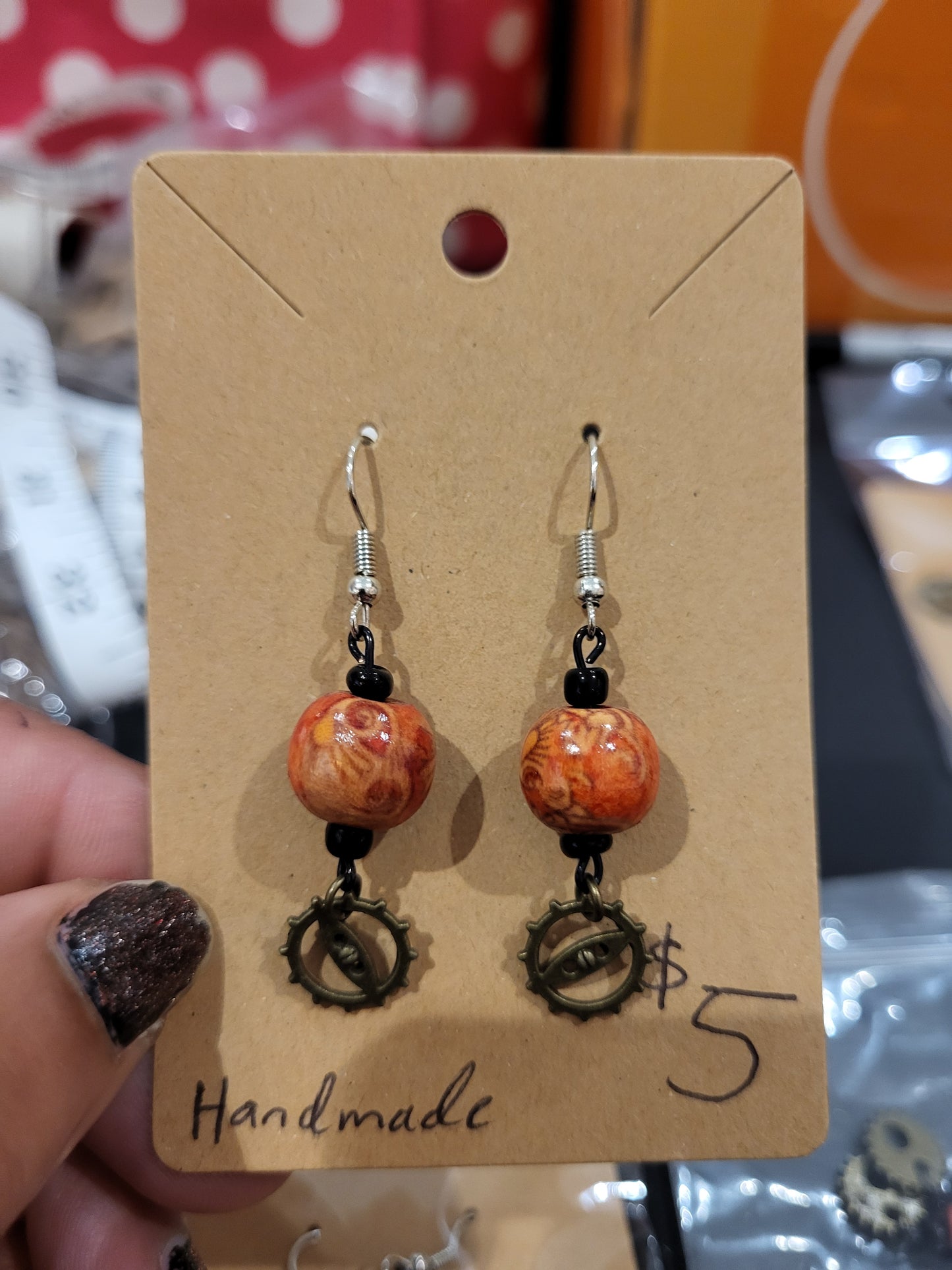 Handmade ornate red bead and mini gear earrings bottom