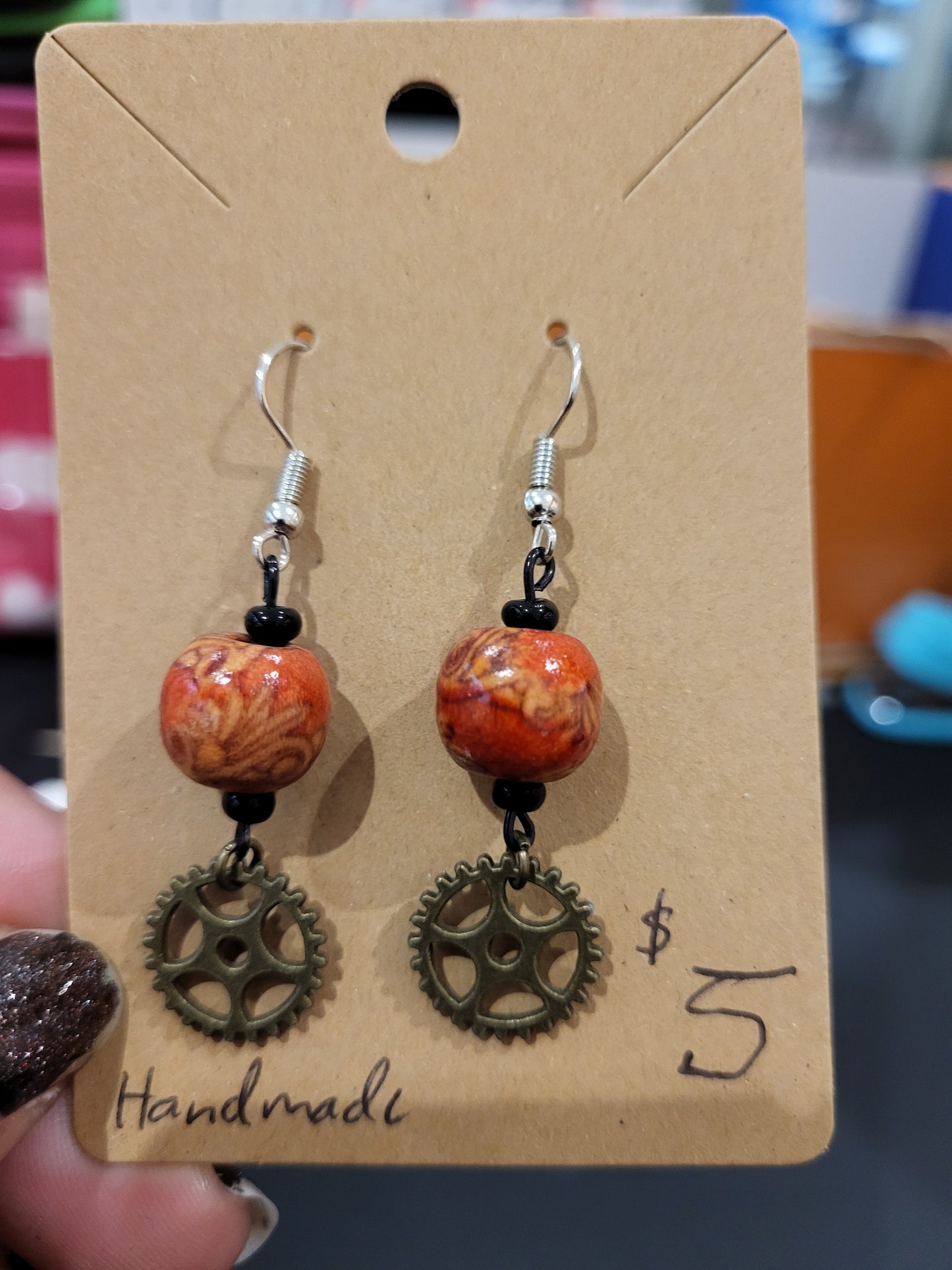 Handmade ornate red bead and mini gear earrings bottom