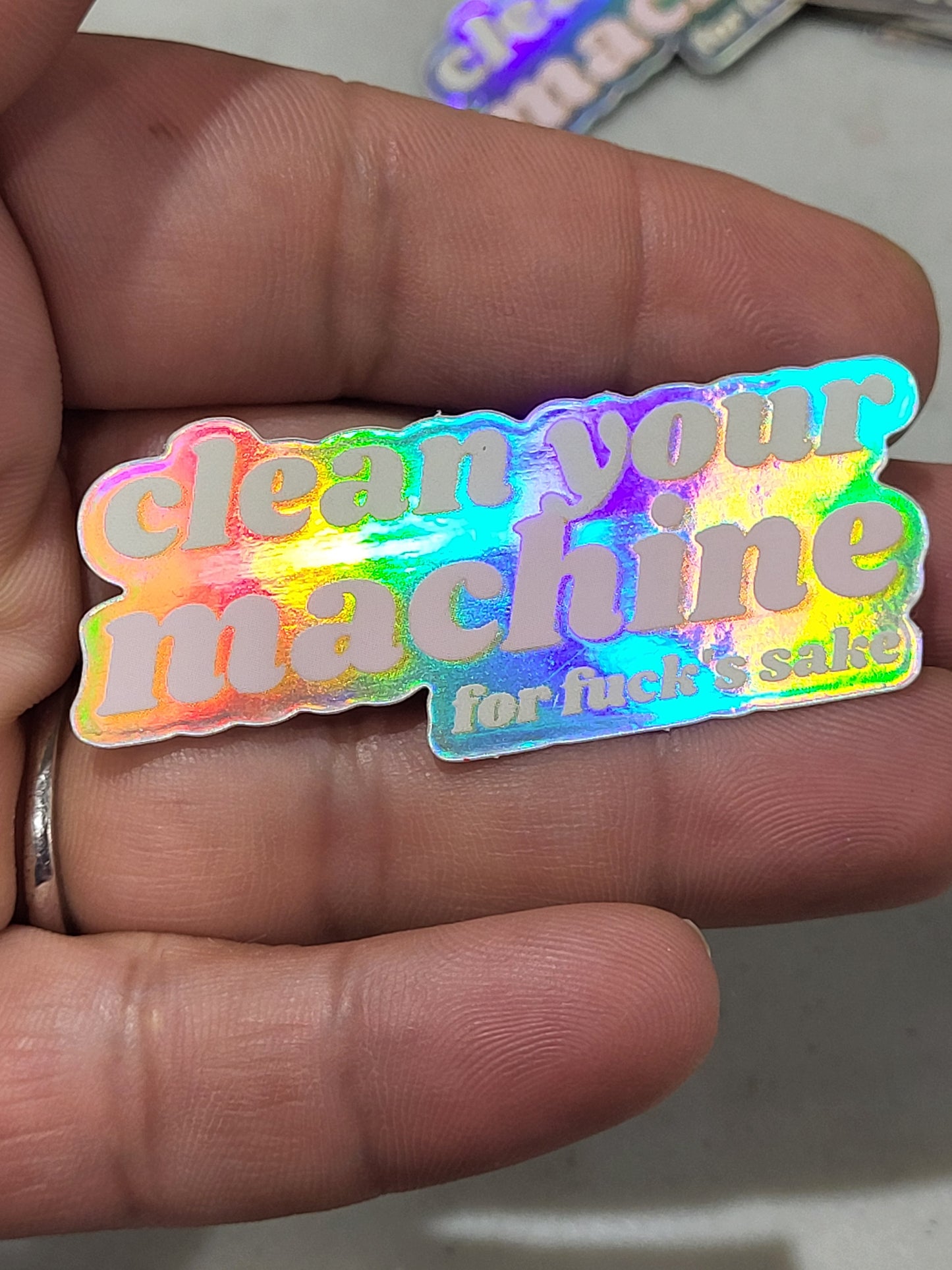 Clean your machine holographic sticker 3/4in x 2in