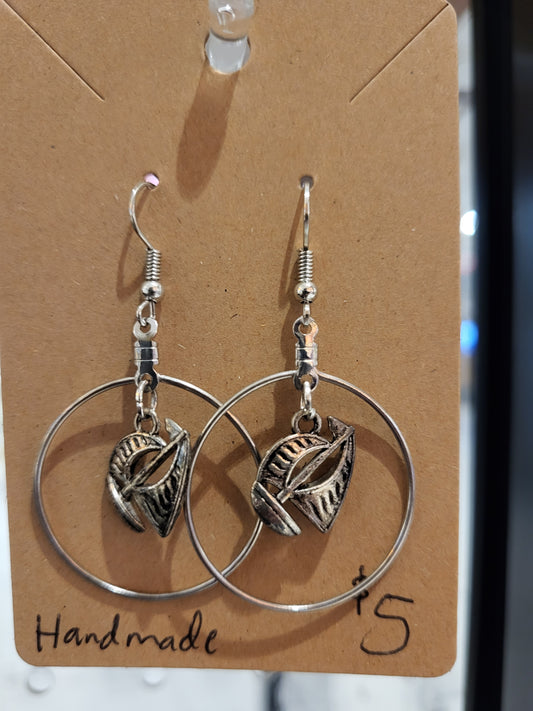 Silver sailboat within a circle earrings.