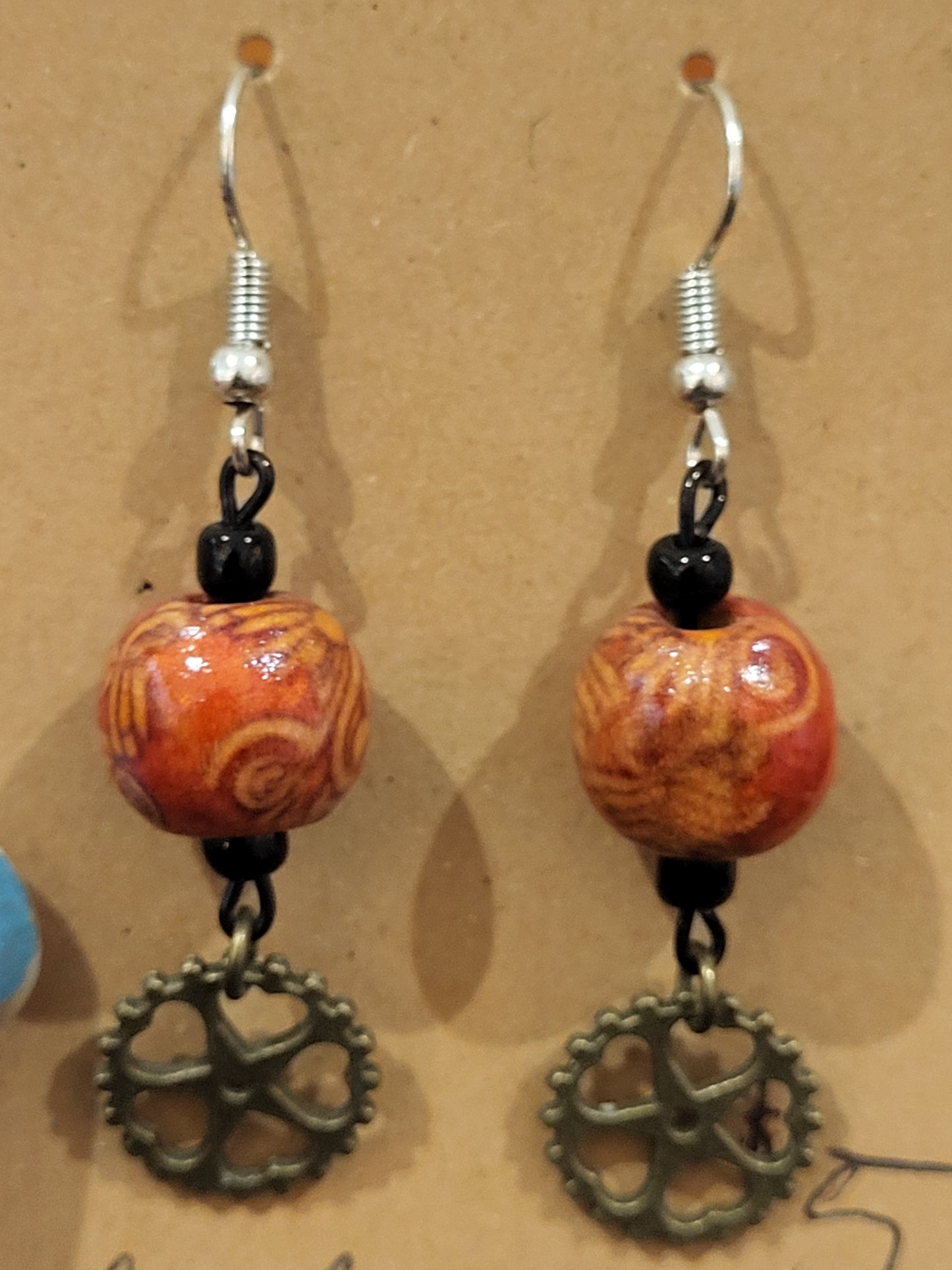 Handmade ornate red bead and heart gear earrings bottom