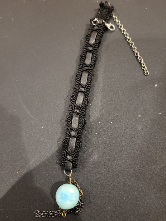 Handmade black choker with blue bead and chain detail