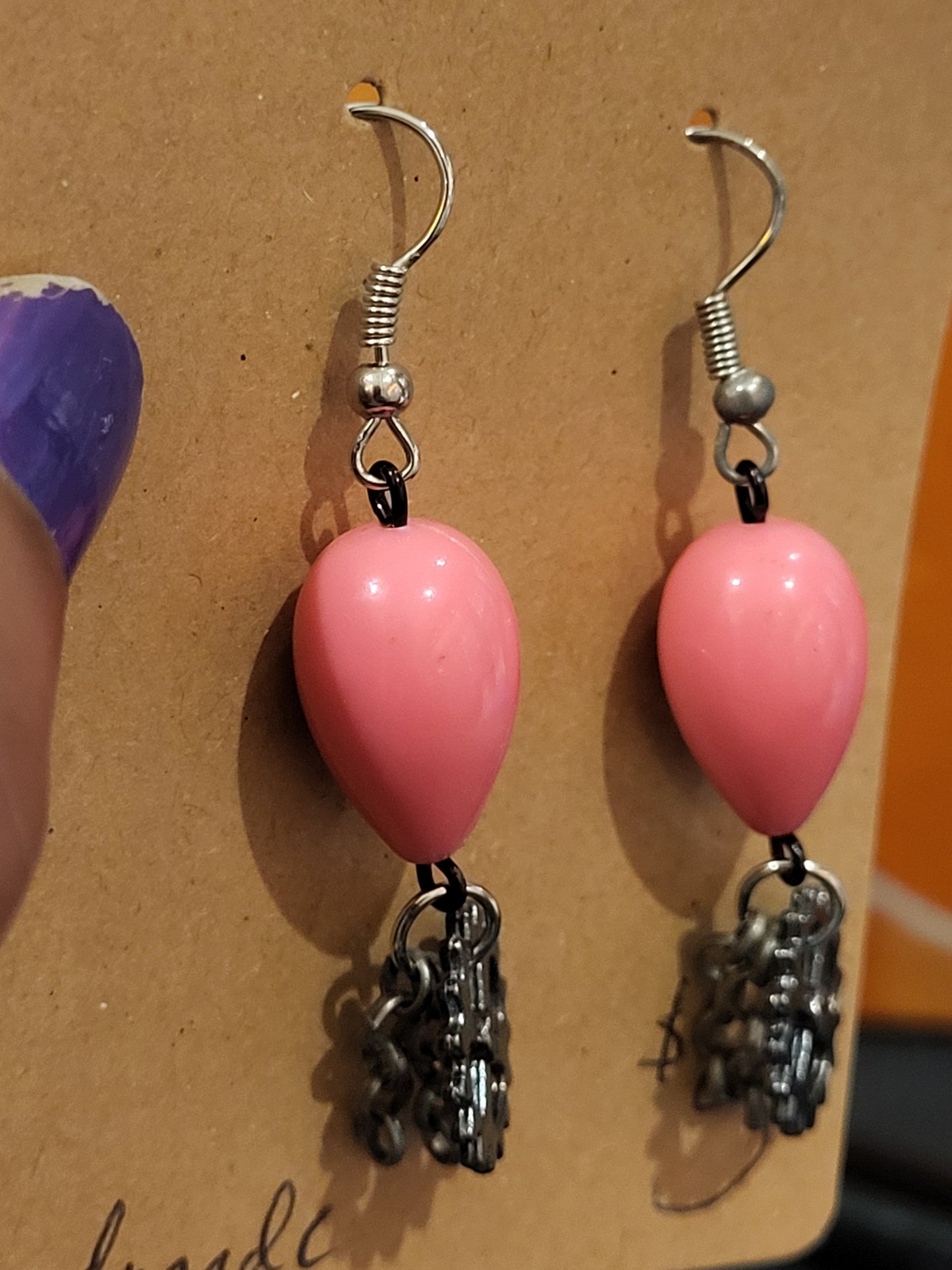 Handmade pink teardrop bead earrings with gear