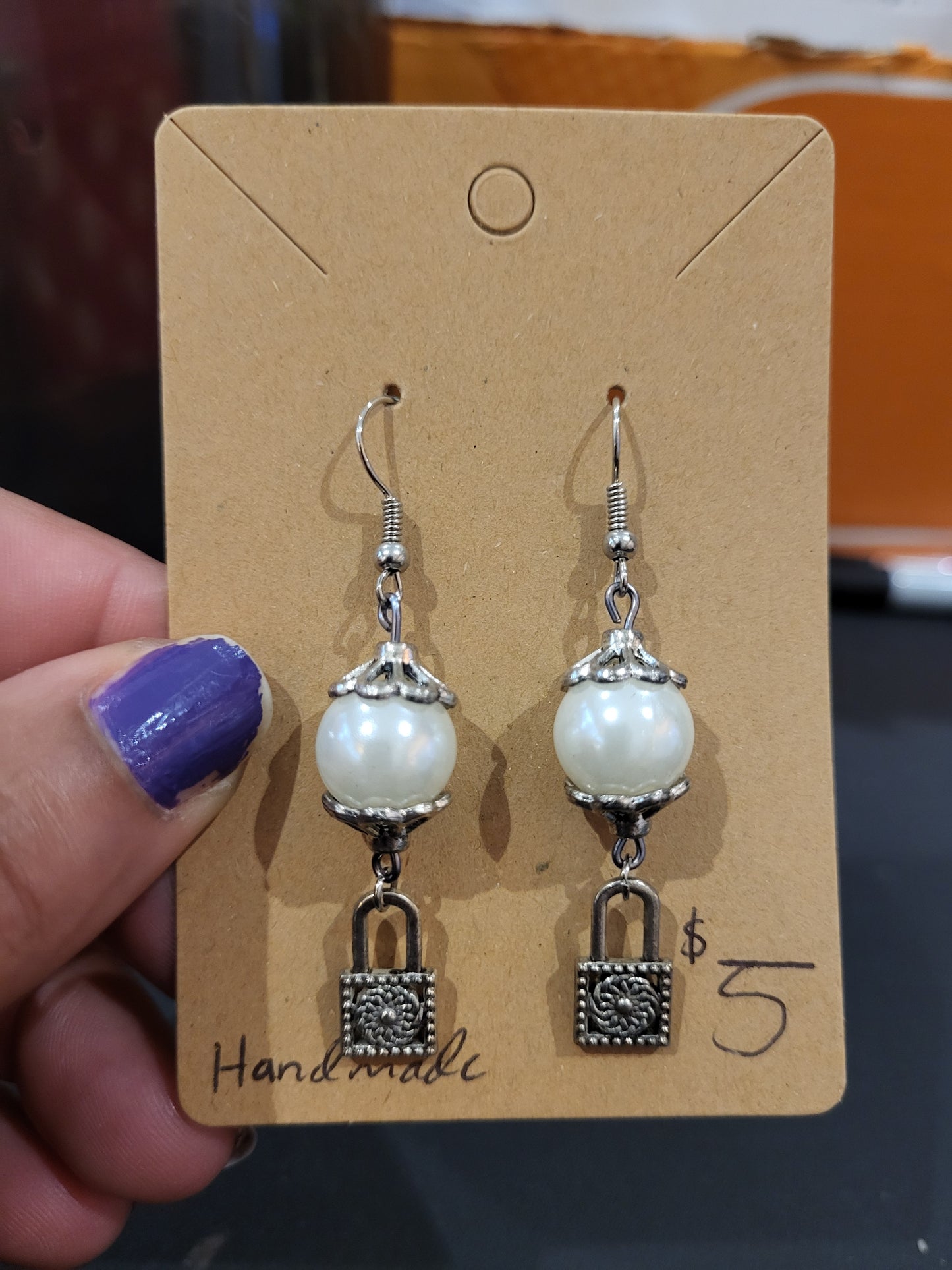 Handmade white and silver earrings with lock charm