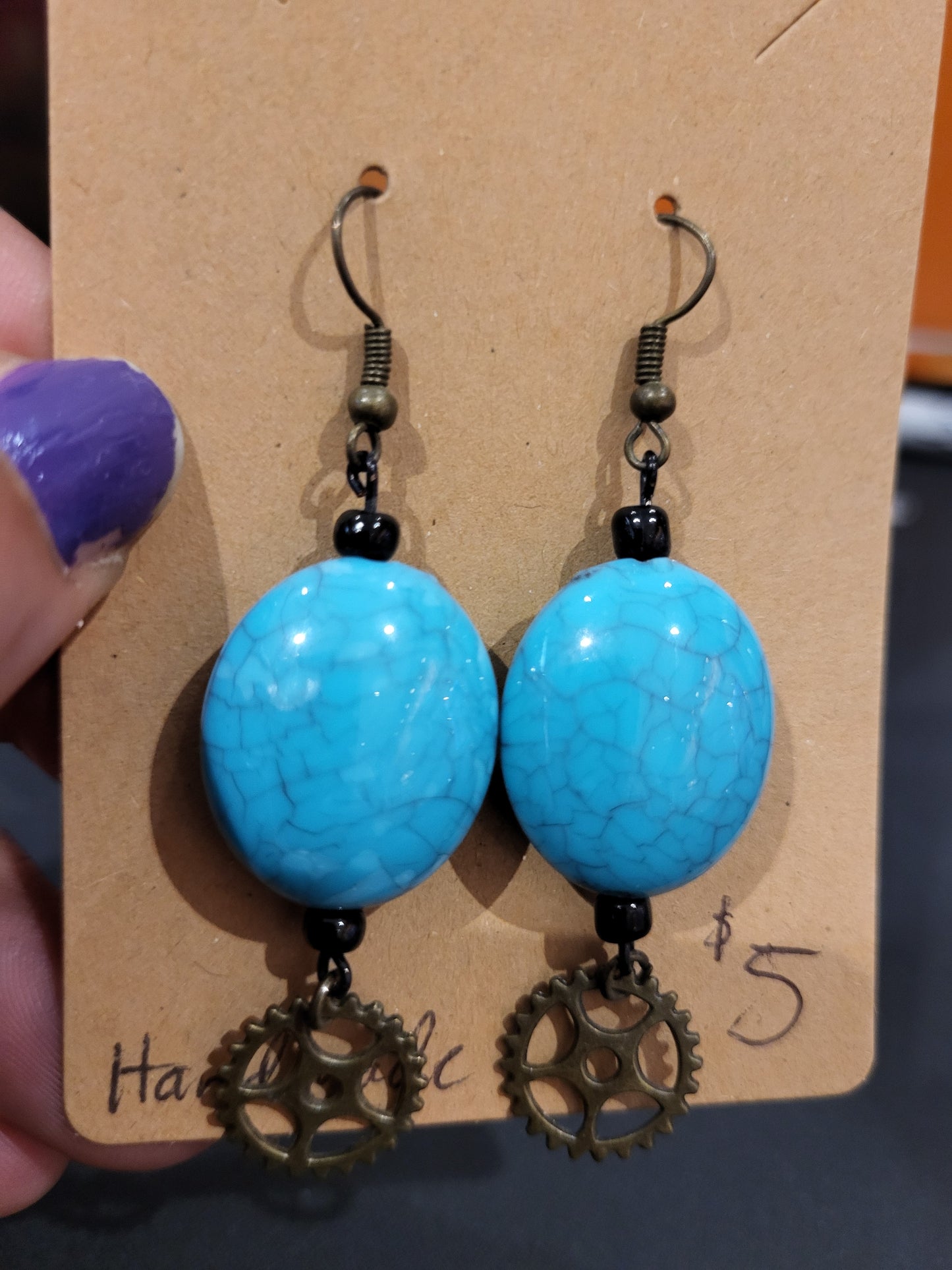 Handmade bright blue bead earrings with gear