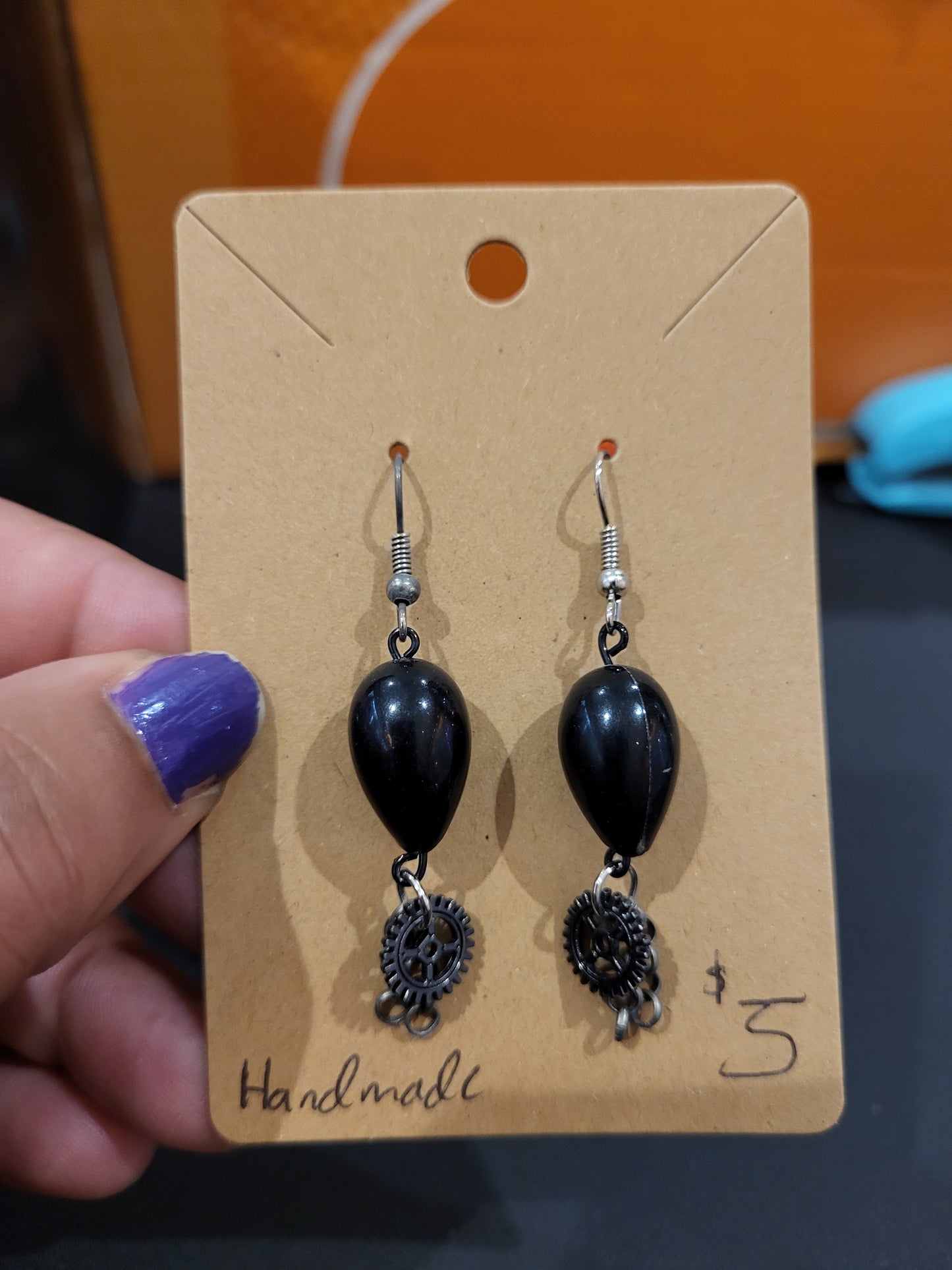 Handmade black teardrop bead earrings with gear