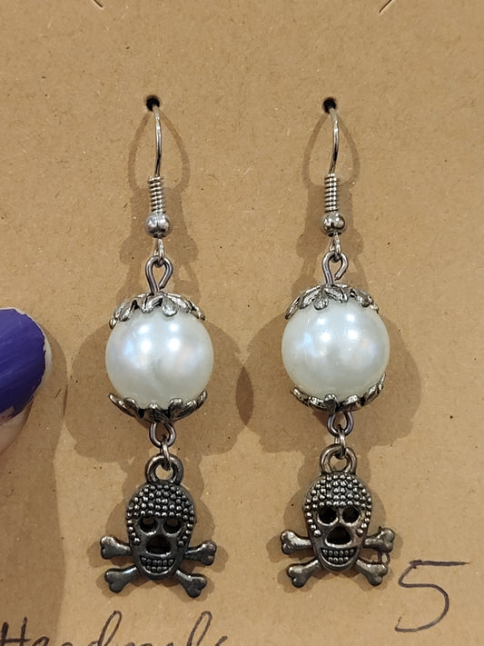 Handmade white and silver earrings with skull charm