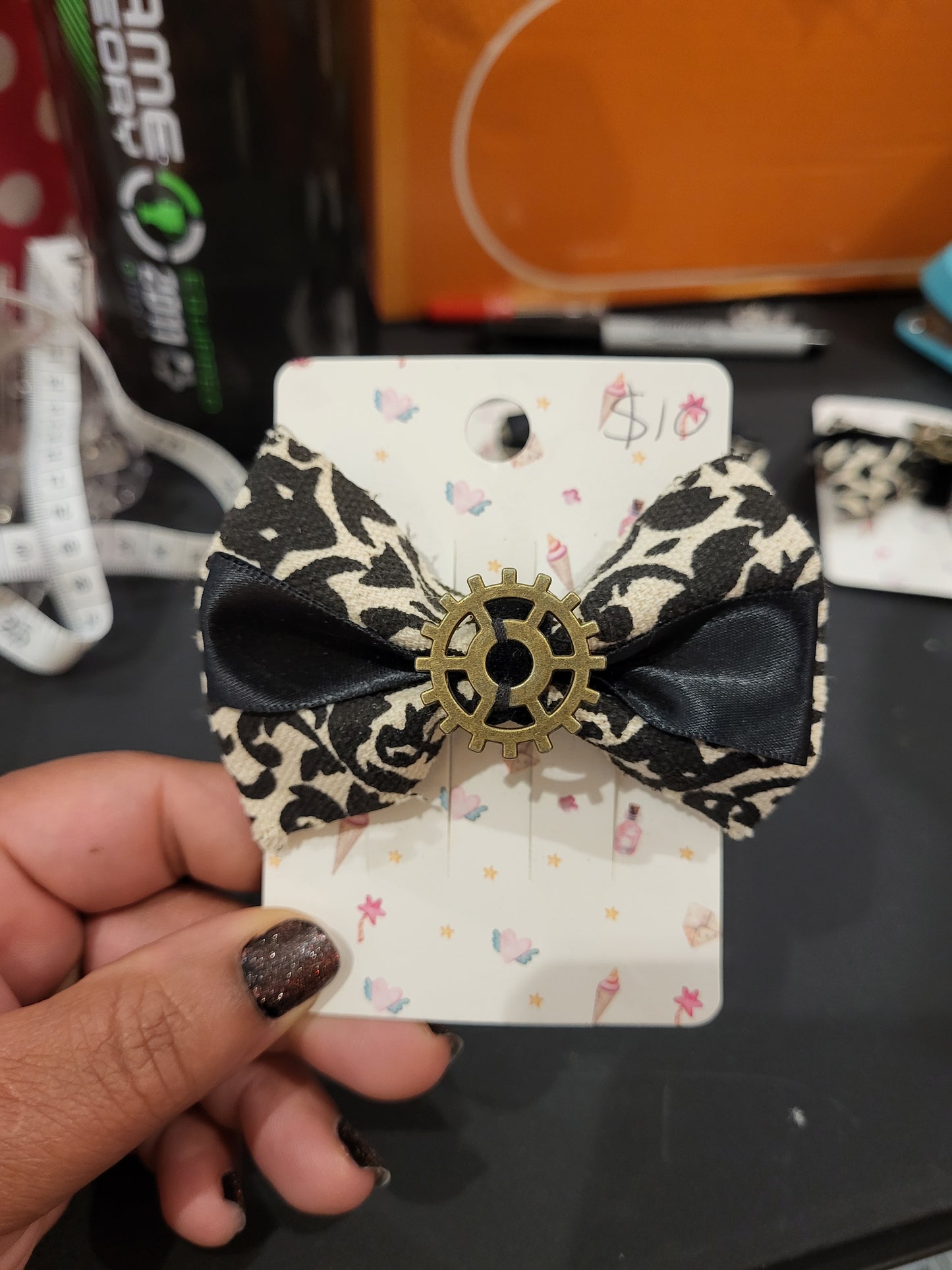 Handmade white and black hair bow with gear