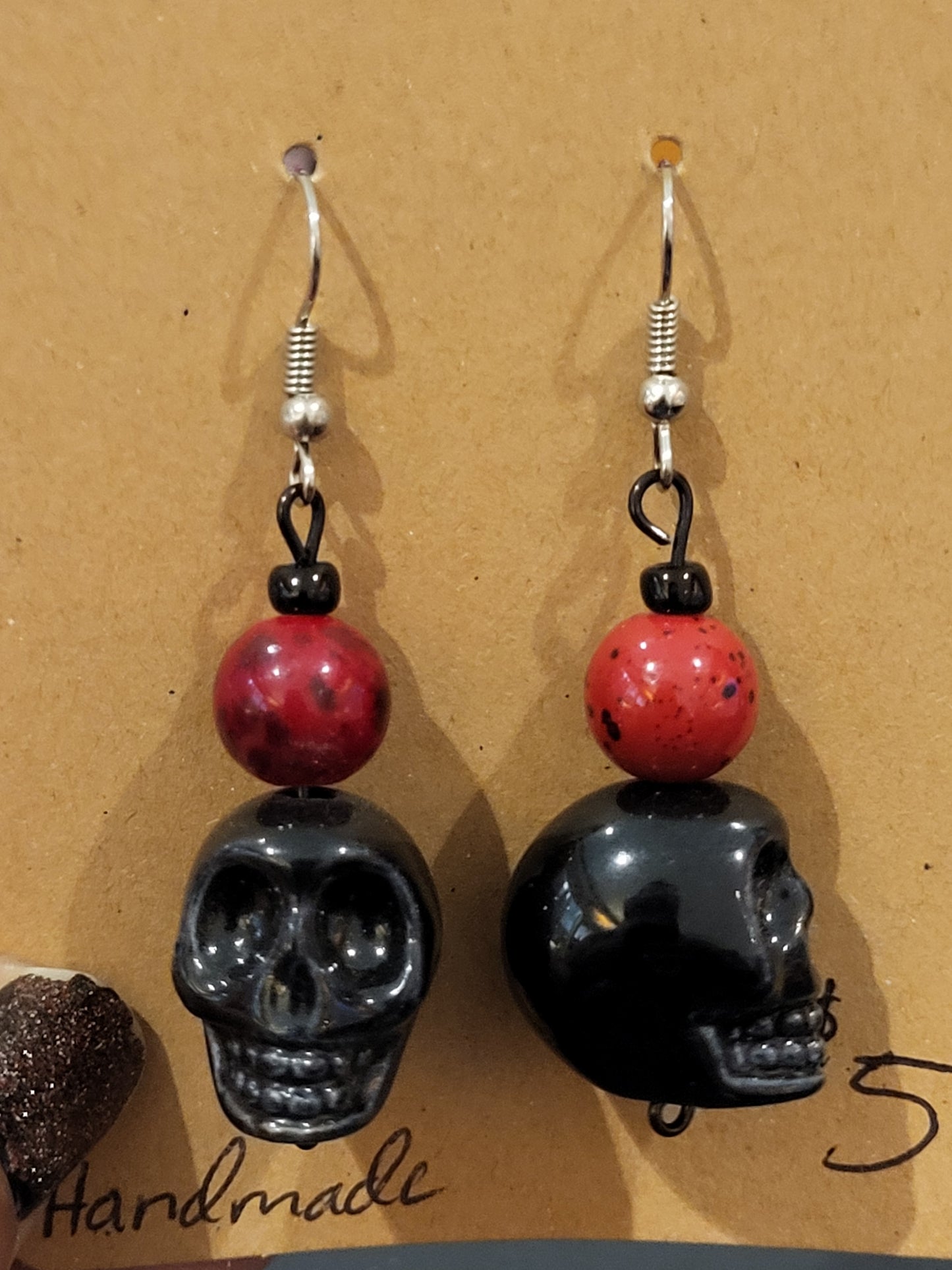 Handmade red bead and black skull earrings
