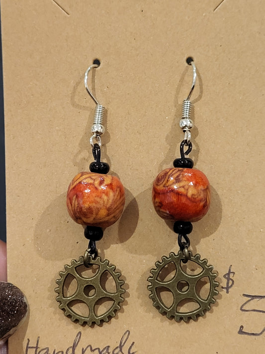 Handmade ornate red bead and mini gear earrings bottom