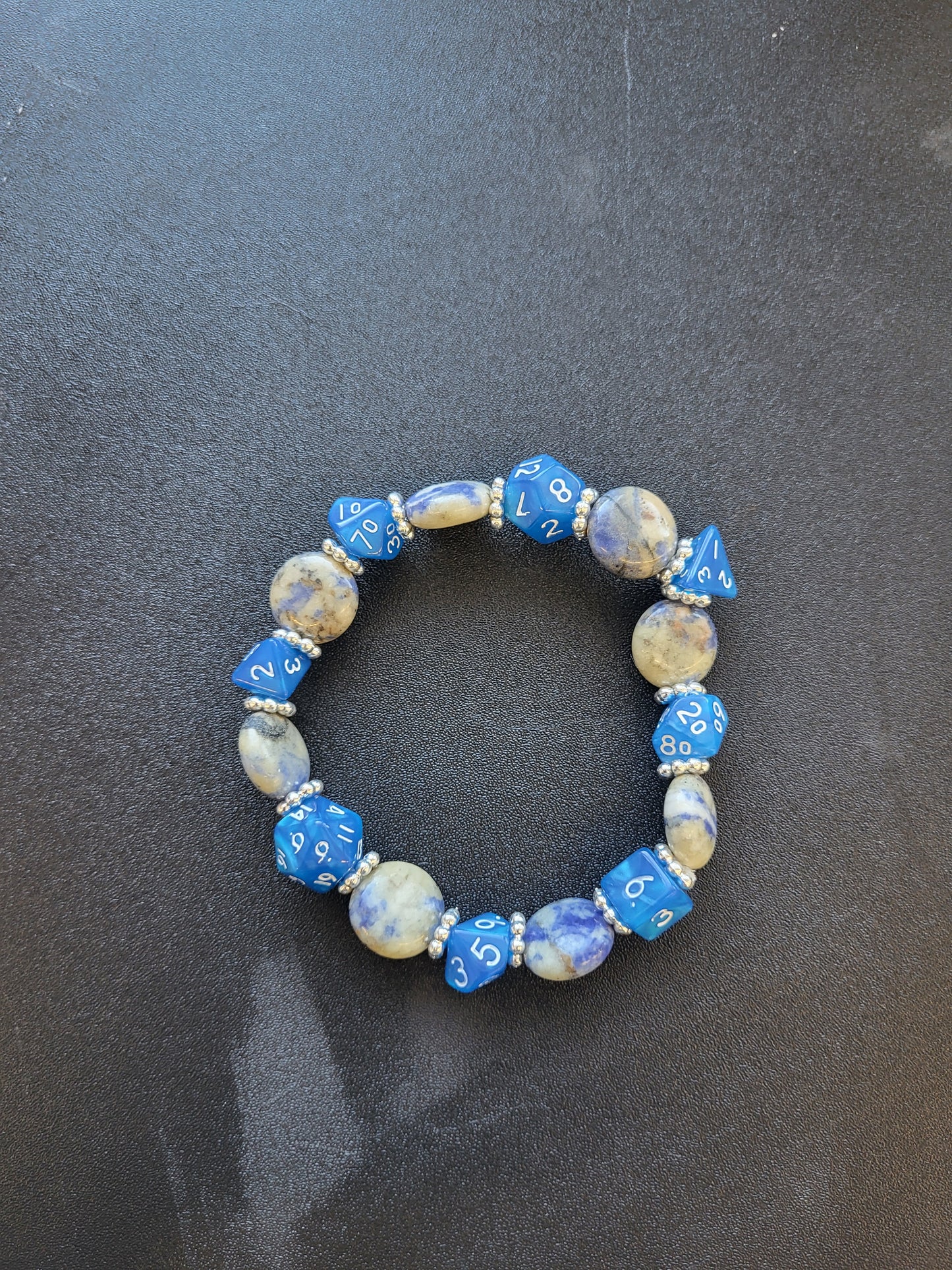 Blue and beige marbled bead and blue dice stretch bracelet