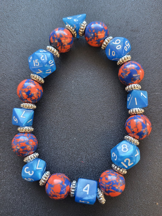 Orange and blue splotchy bead and blue dice stretch bracelet