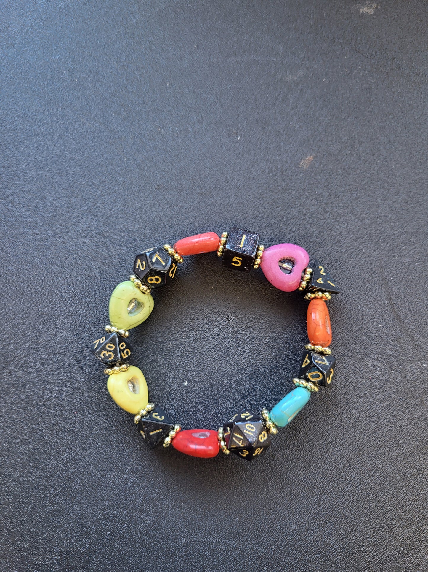 Multi colored heart bead and black dice stretch bracelet