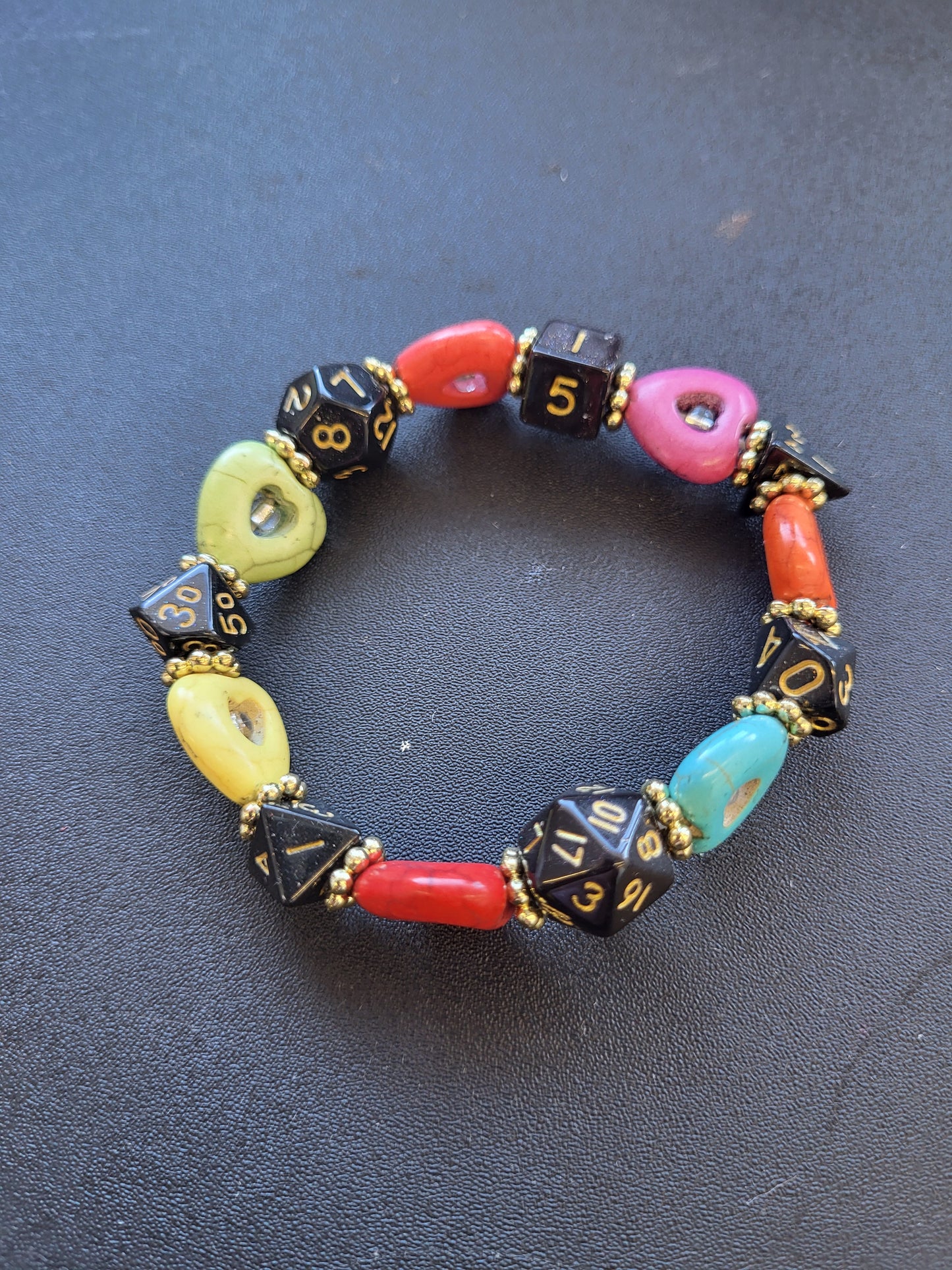 Multi colored heart bead and black dice stretch bracelet