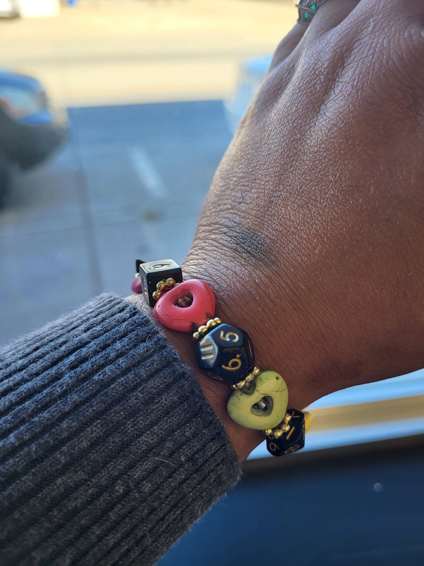 Multi colored heart bead and black dice stretch bracelet