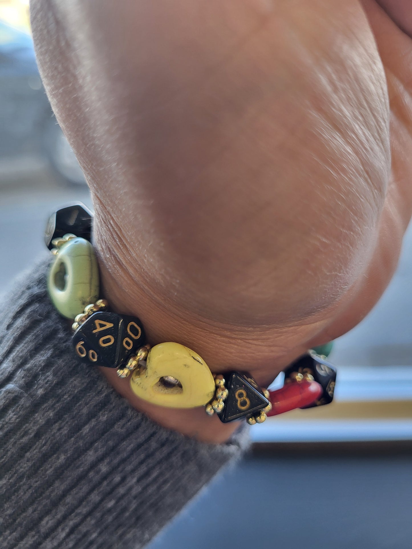 Multi colored heart bead and black dice stretch bracelet