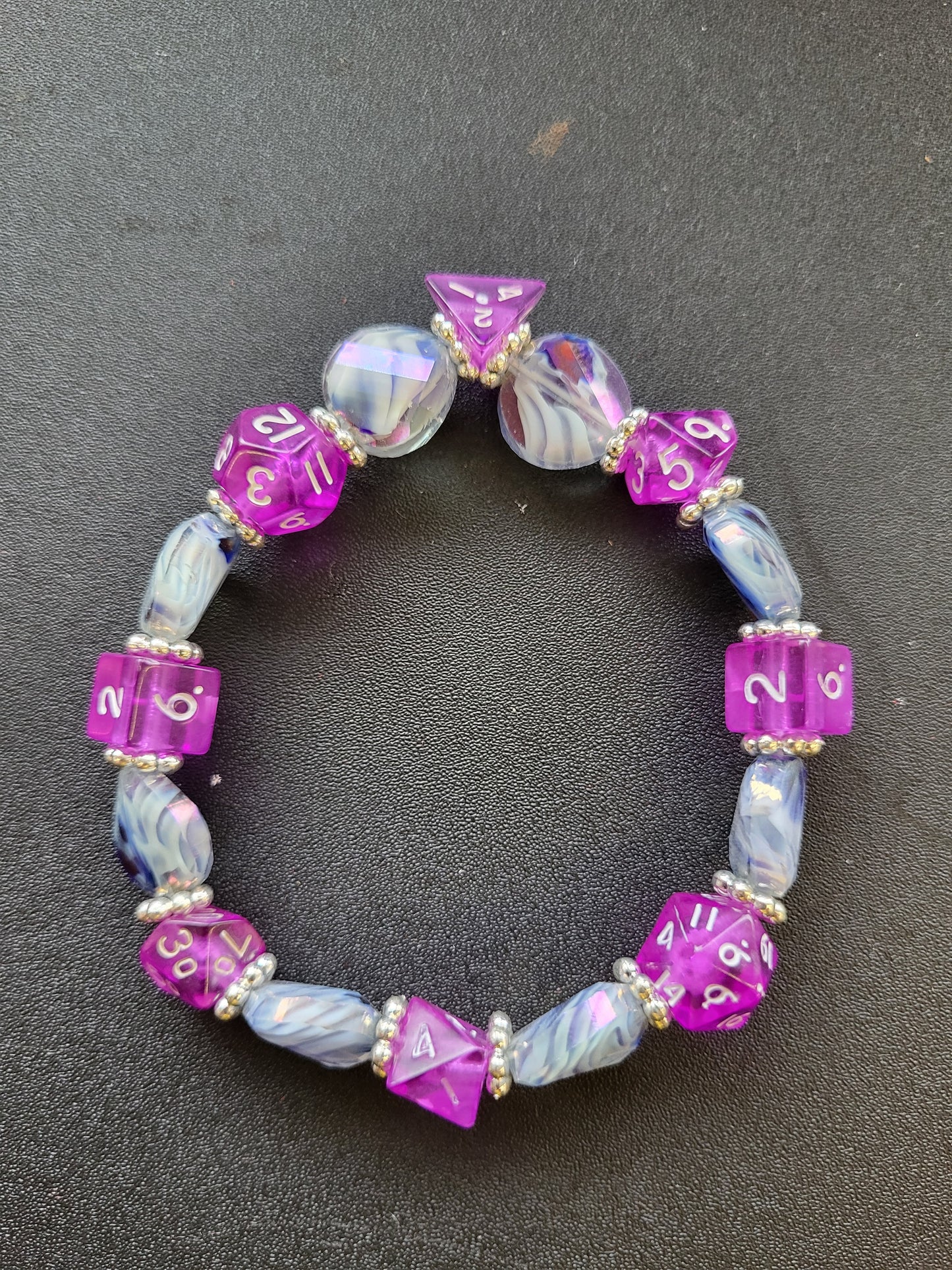 Blue and white wave bead and purple dice stretch bracelet