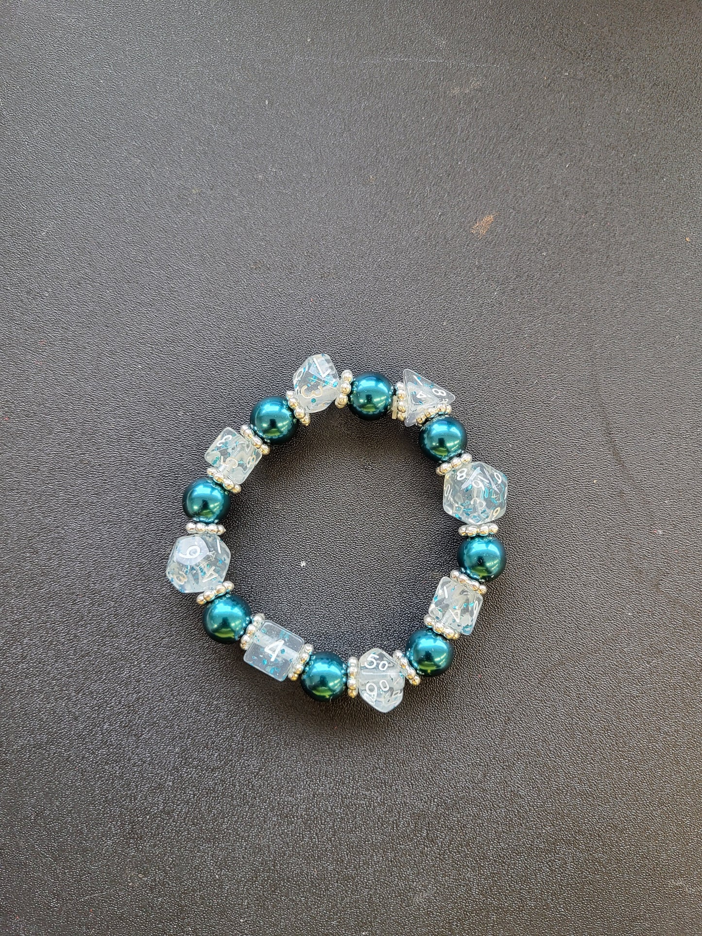 Teal bead and clear mini dice stretch bracelet