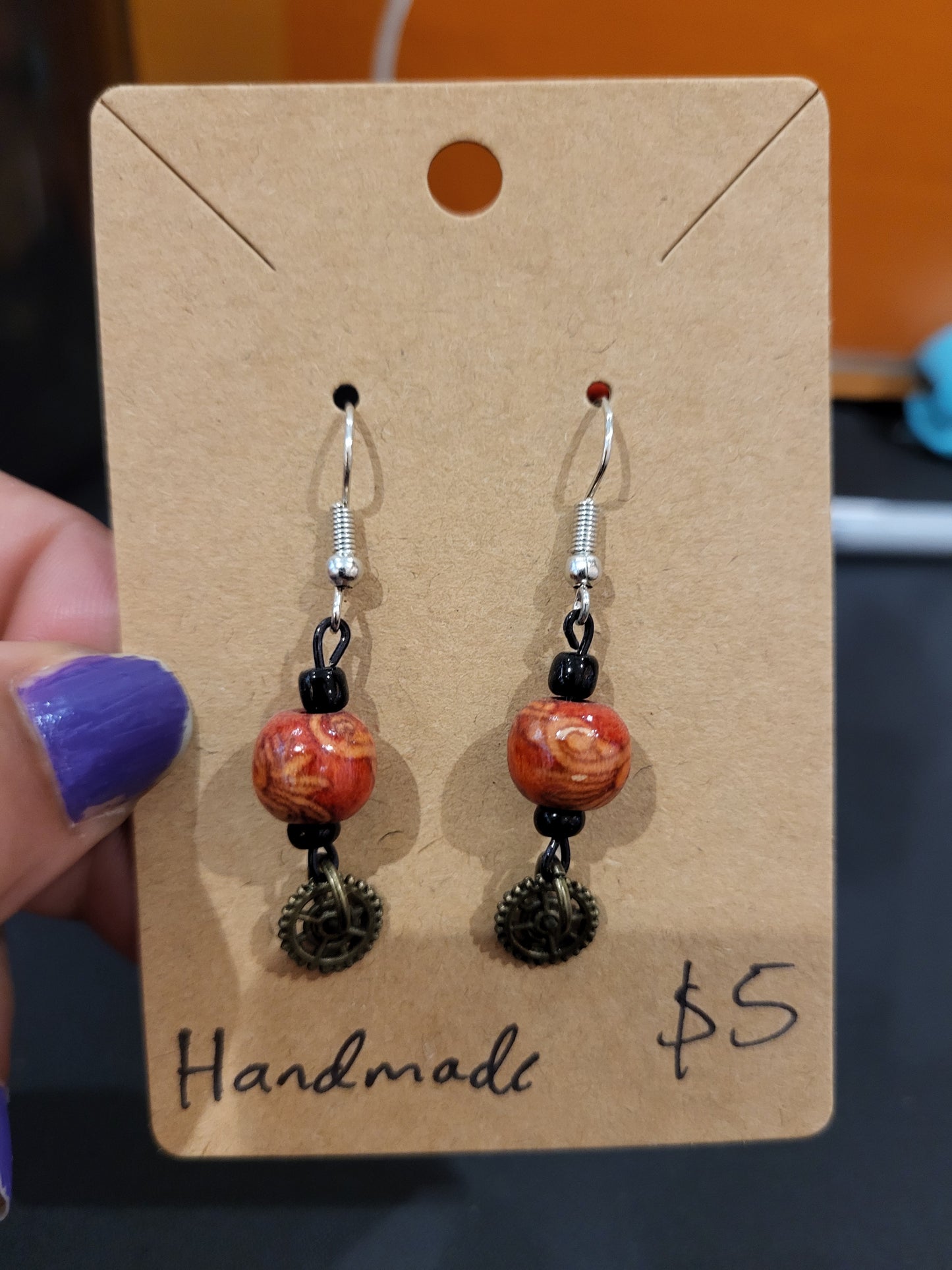 Handmade ornate red bead and mini gear earrings bottom