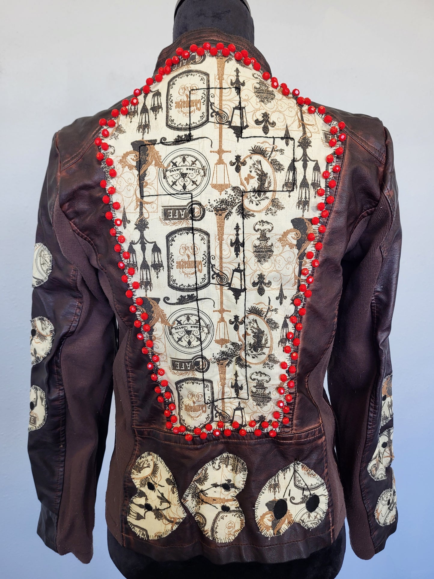 Upcycled women's faux leather jacket with patches and red beading size medium- one of a kind