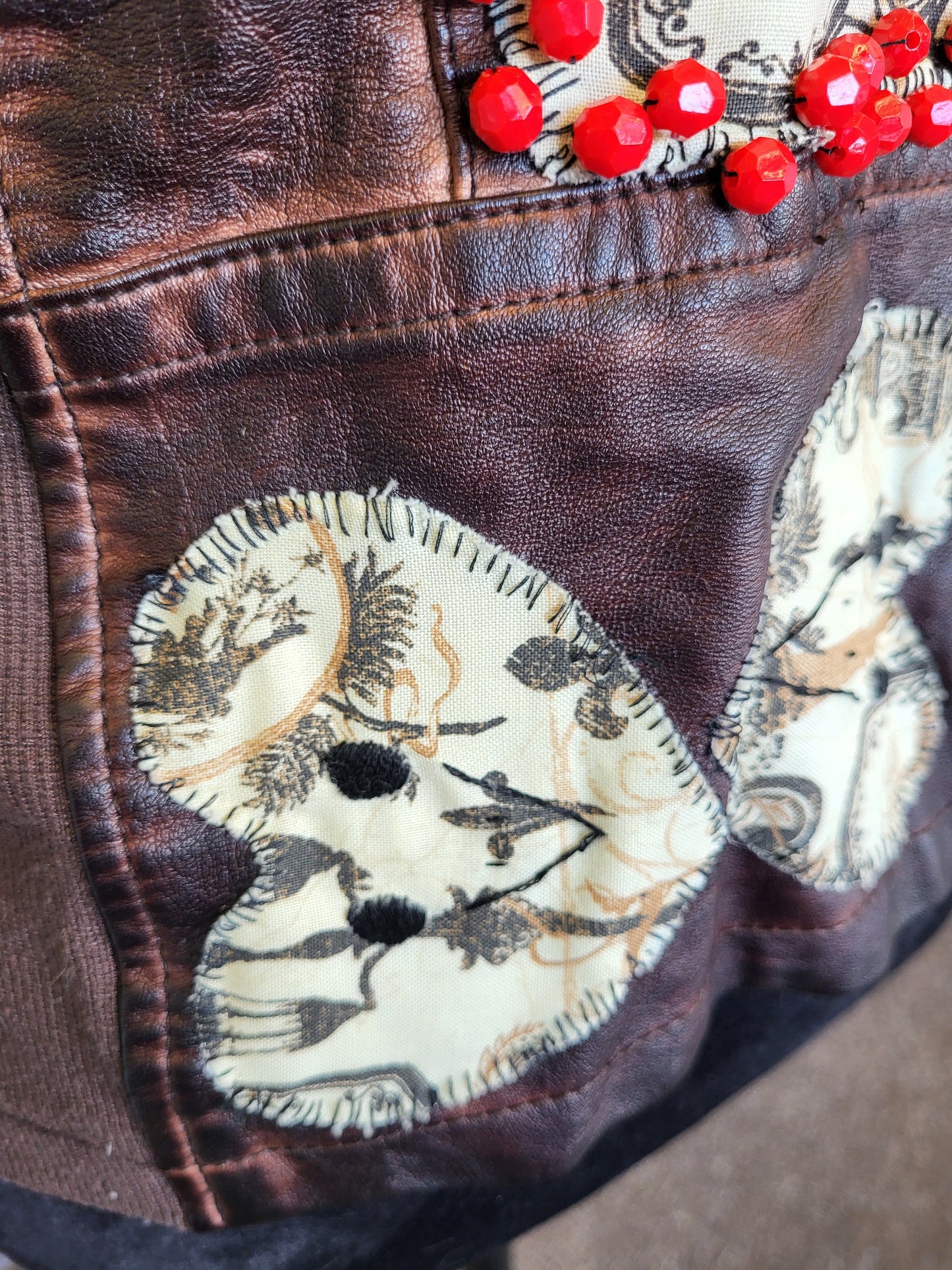 Upcycled women's faux leather jacket with patches and red beading size medium- one of a kind