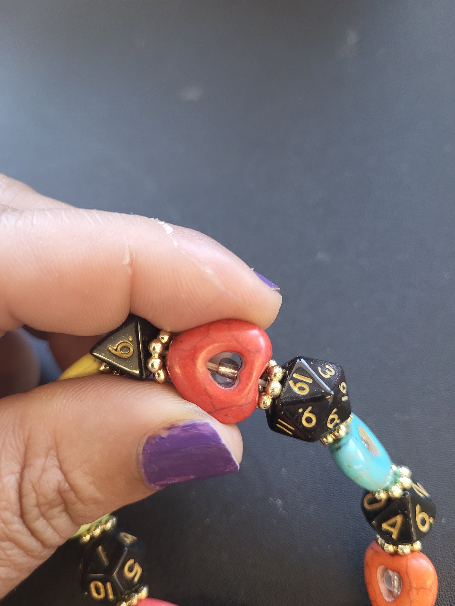 Multi colored heart bead and black dice stretch bracelet