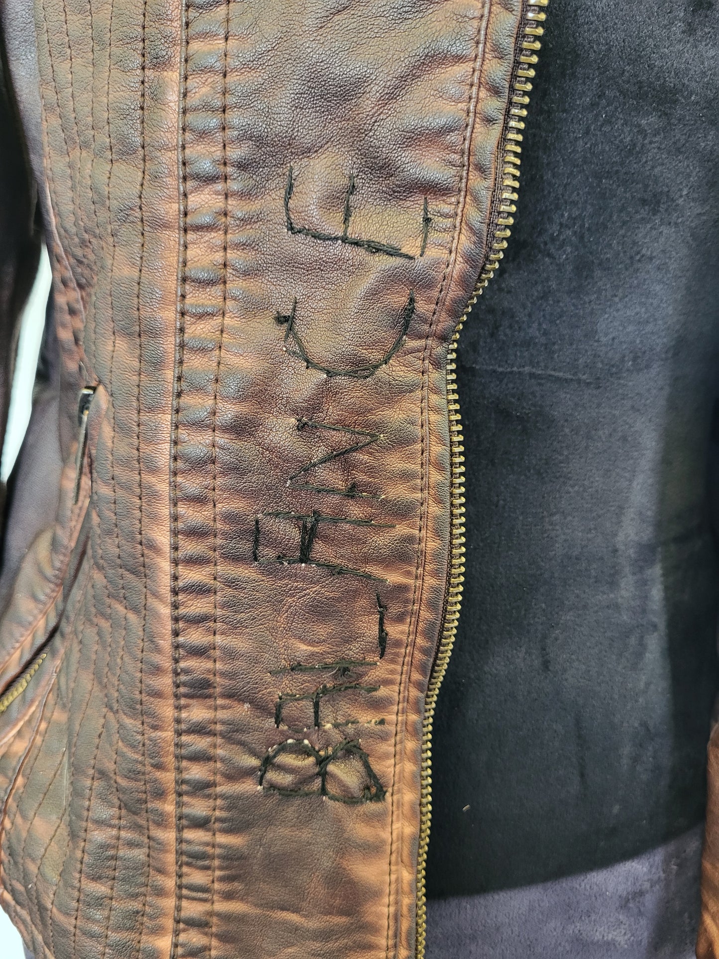 Upcycled women's faux leather jacket with patches and red beading size medium- one of a kind