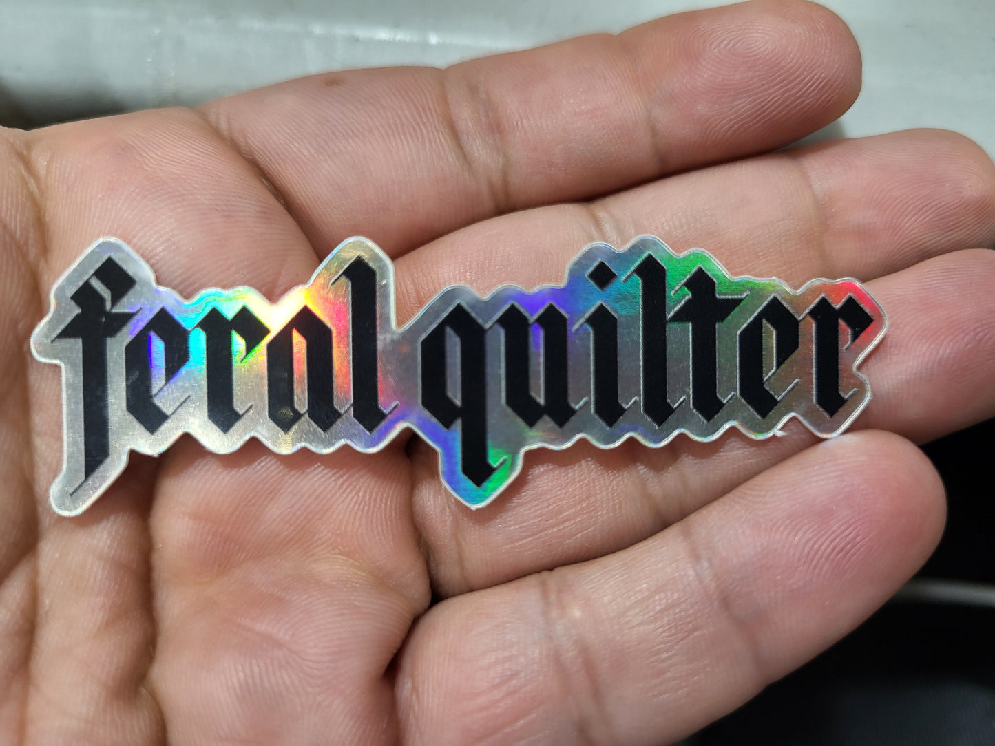 Feral quilter holographic sticker 3/4in x 2 3/4in