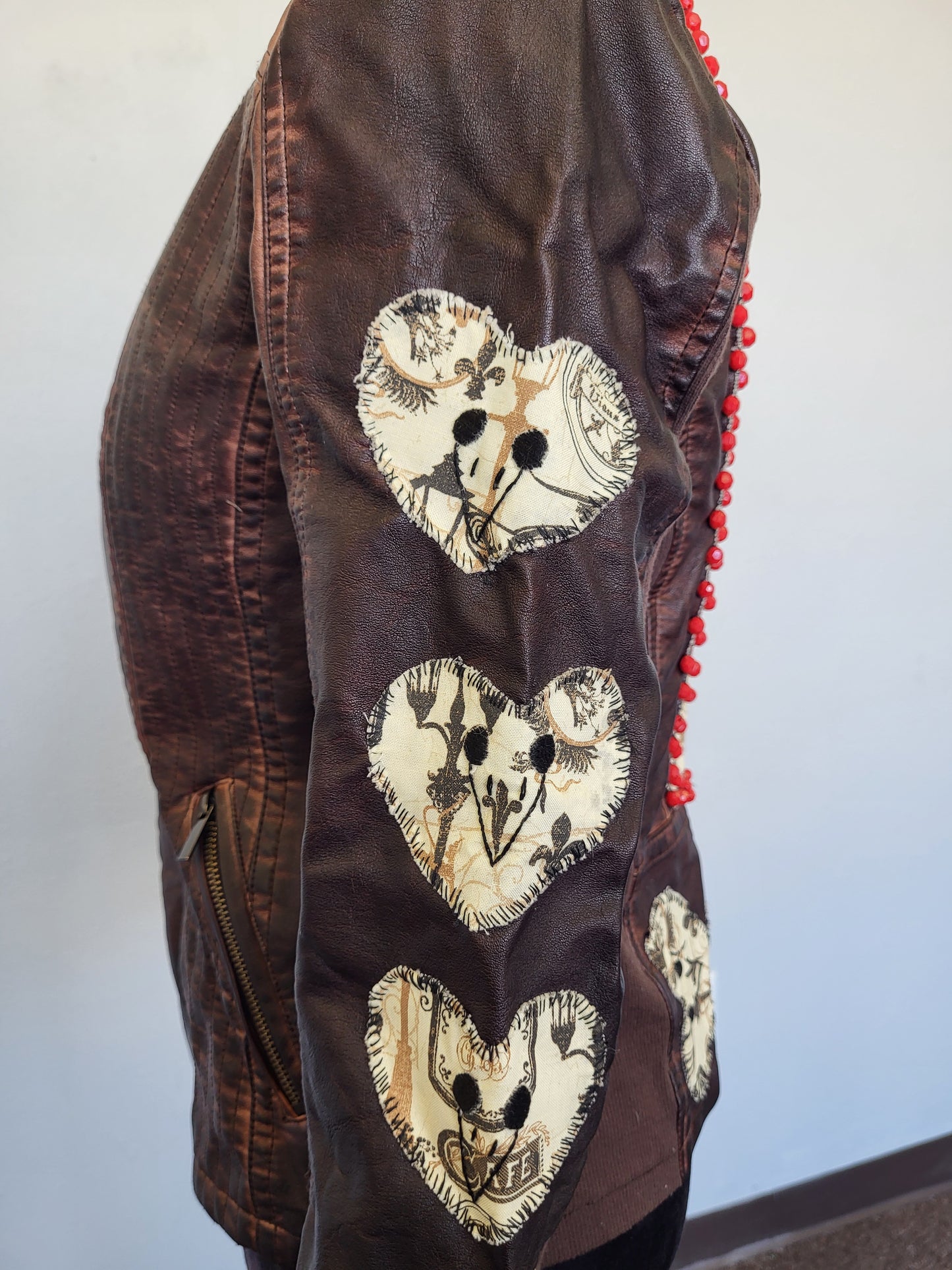 Upcycled women's faux leather jacket with patches and red beading size medium- one of a kind