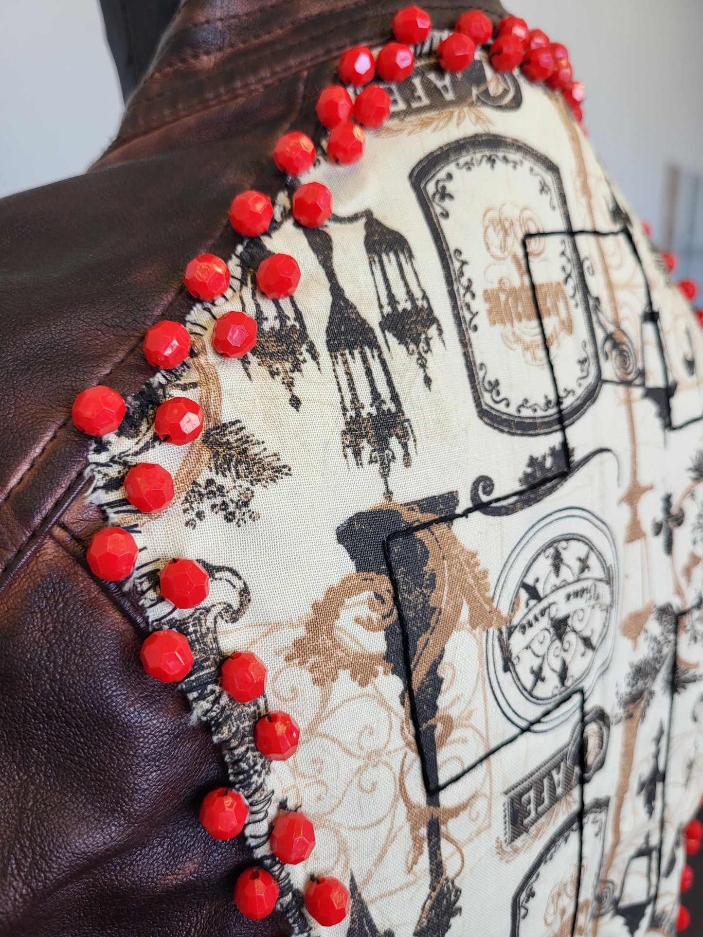 Upcycled women's faux leather jacket with patches and red beading size medium- one of a kind